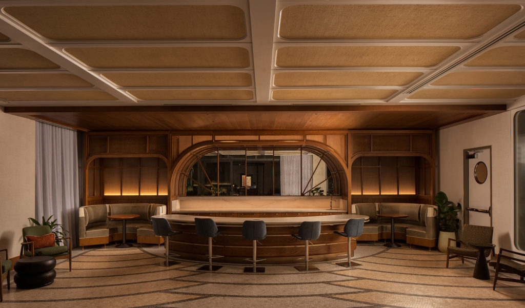 Community lounge with bar seating and booths.